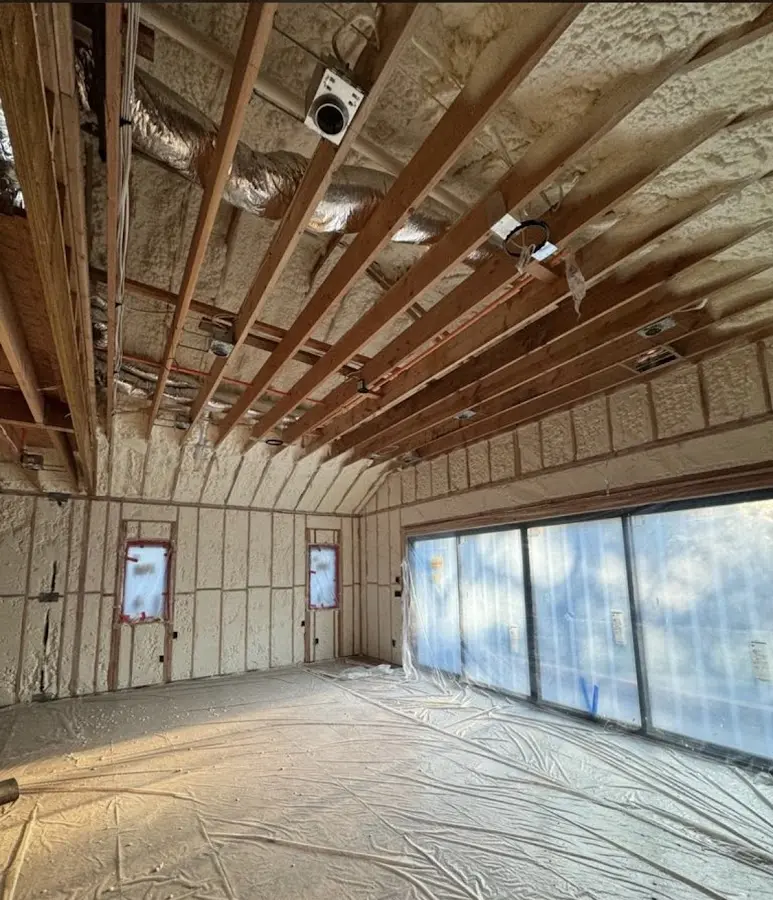 Interior walls and ceiling insulated with spray foam during new construction in Conroe